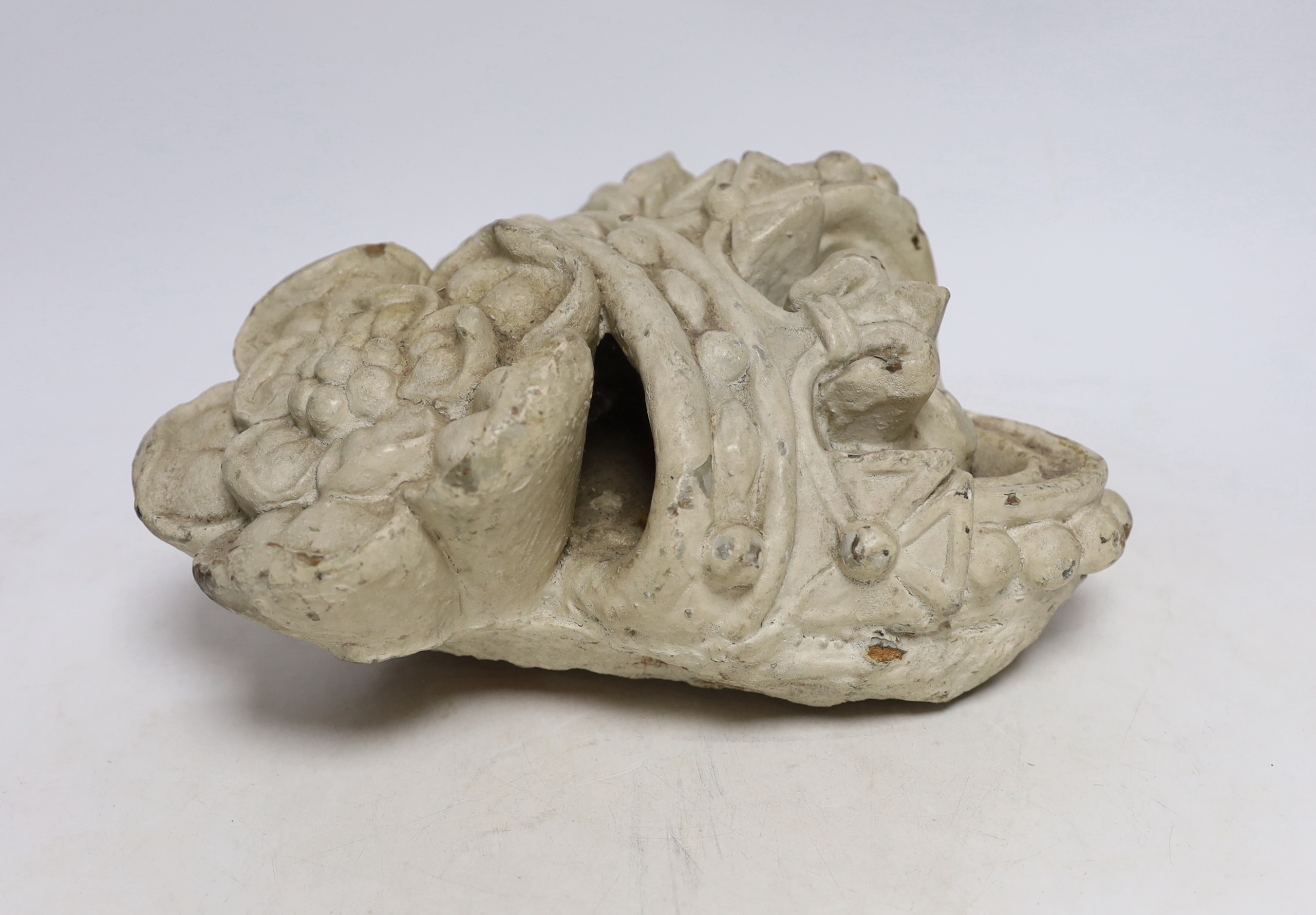 A White painted terracotta architectural cresting in the form coronet over a Tudor rose, 26cm high